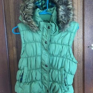 Green puffer vest with furry hood
